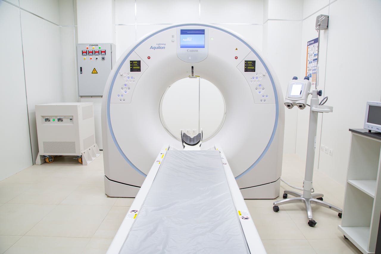 services-01 High-quality image of a modern MRI scanner in a sterile hospital room, ready for use.